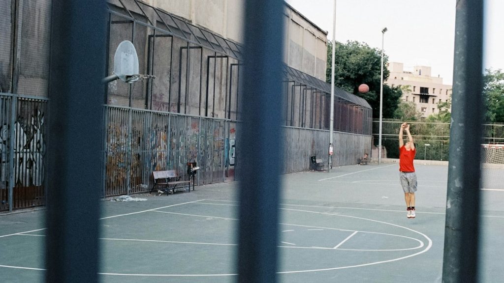 Basketball player in a playground in Madrid, Spain